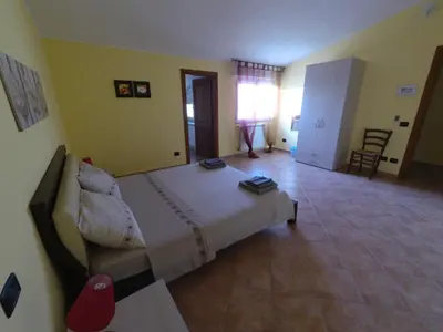 Letto o letti in una camera di La Mansarda Carbonia It