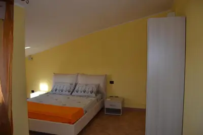 Letto o letti in una camera di La Mansarda Carbonia It