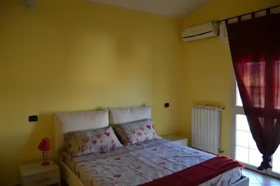 Letto o letti in una camera di La Mansarda Carbonia It