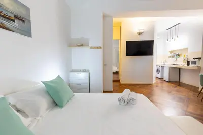 Letto o letti in una camera di Maison Saint Remy - Heart of Cagliari