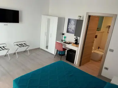 TV o dispositivi per l'intrattenimento presso Mhometredici Camera Matrimoniale La Traviata
