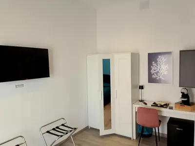 TV o dispositivi per l'intrattenimento presso Mhometredici Camera Matrimoniale La Traviata
