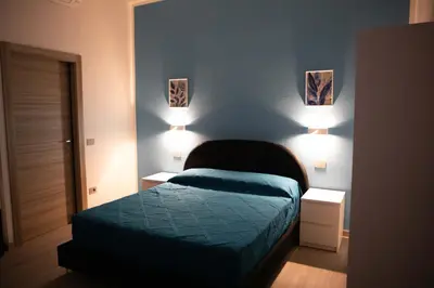 Letto o letti in una camera di Mhometredici Camera Matrimoniale La Traviata