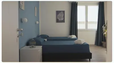 Letto o letti in una camera di Mhometredici Camera doppia Otello
