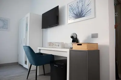 TV o dispositivi per l'intrattenimento presso Mhometredici Camera doppia Otello