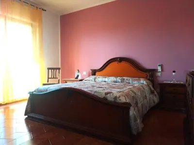 Letto o letti in una camera di Casa Angelina