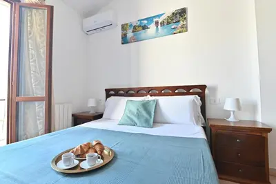 Letto o letti in una camera di IzzHome Comfort