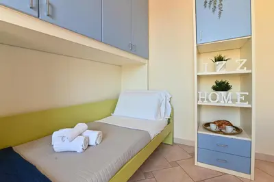 Letto o letti in una camera di IzzHome Comfort