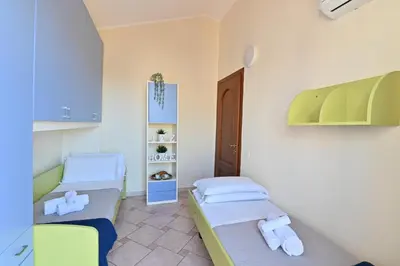 Letto o letti in una camera di IzzHome Comfort