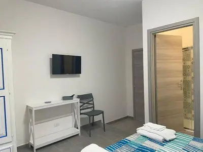 TV o dispositivi per l'intrattenimento presso Casa vacanze Domu e Mari - ideale per famiglie e gruppi