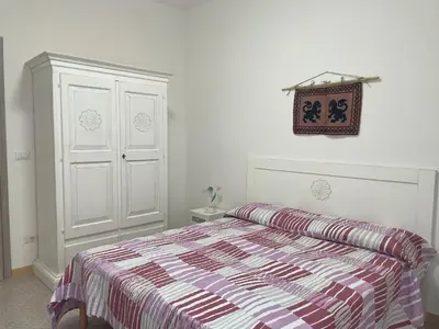 Letto o letti in una camera di Casa vacanze Domu e Mari - ideale per famiglie e gruppi
