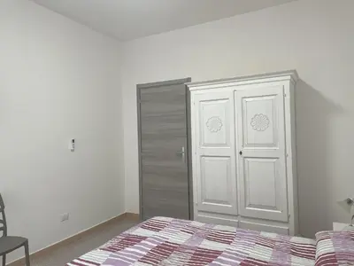 Letto o letti in una camera di Casa vacanze Domu e Mari - ideale per famiglie e gruppi