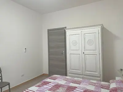 Letto o letti in una camera di Affitta camere - Casa vacanze Domu e Mari