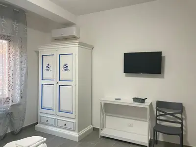 TV o dispositivi per l'intrattenimento presso Affitta camere - Casa vacanze Domu e Mari