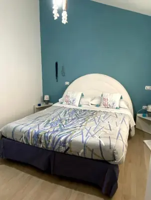 Letto o letti in una camera di Villa Mammarella