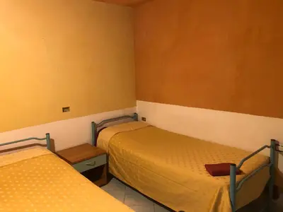 Letto o letti in una camera di Casa vacanza