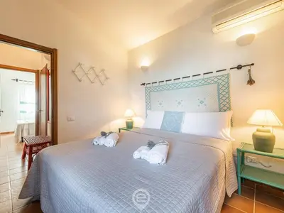 Letto o letti in una camera di Casa Belvedere