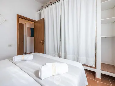 Letto o letti in una camera di Casa Belvedere