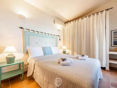 Letto o letti in una camera di Casa Belvedere
