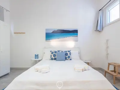 Letto o letti in una camera di Saturnino - Apartment