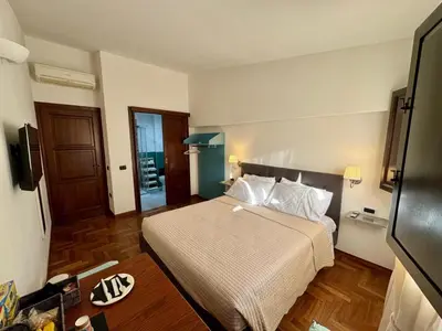 Letto o letti in una camera di Casa Baronia