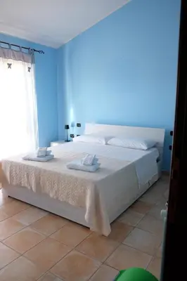 Letto o letti in una camera di B&B Sa Sinniesa