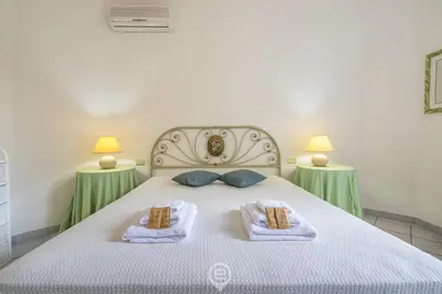 Letto o letti in una camera di Villa Chiara