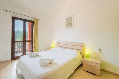 Letto o letti in una camera di South Sardinia Holidays, 5 minutes to Chia