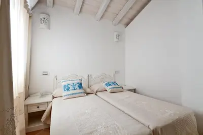 Letto o letti in una camera di Villa Calicanto in esclusiva