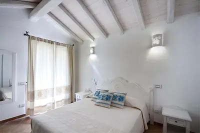 Letto o letti in una camera di Villa Calicanto in esclusiva