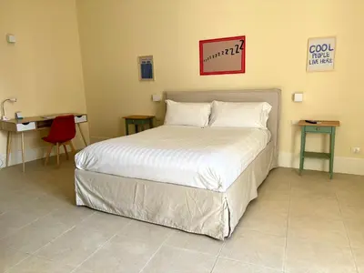 Letto o letti in una camera di Cagliari Downtown - Piazza Martiri suite