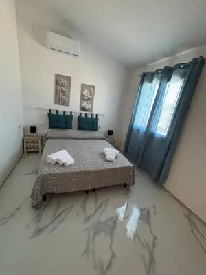 Letto o letti in una camera di Villa Azzurra