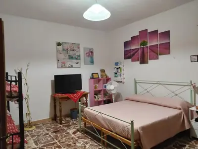 Letto o letti in una camera di Casa Muscas