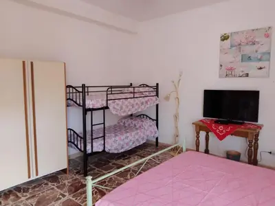 Letto o letti in una camera di Casa Muscas