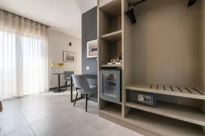 TV o dispositivi per l'intrattenimento presso Solì Suite & Rooms