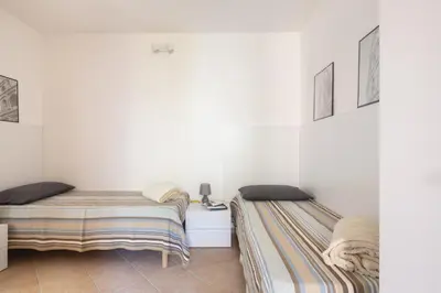 Letto o letti in una camera di MICHI Holiday Home Tortolì
