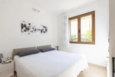 Letto o letti in una camera di MICHI Holiday Home Tortolì