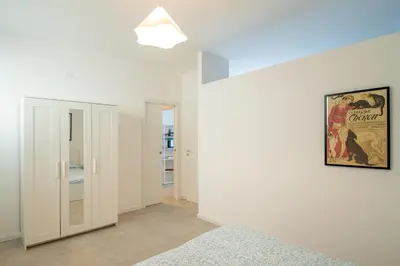 Letto o letti in una camera di MagliaNeraApartment