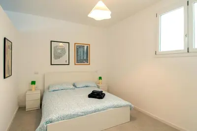 Letto o letti in una camera di MagliaNeraApartment