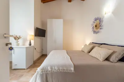 Letto o letti in una camera di La Margherita Guesthouse, Nebida seaview