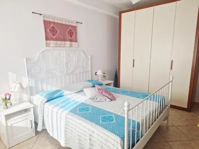 Letto o letti in una camera di Casa Dafne Tortolì centro