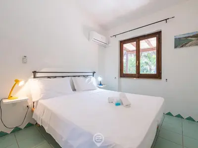 Letto o letti in una camera di Casa di Marco
