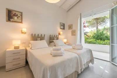 Letto o letti in una camera di Lux Villa Fiorenza, 250 m to beach SouthSardiniaHolidays