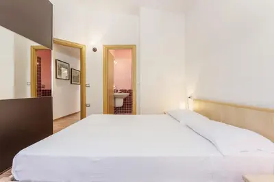 Letto o letti in una camera di Casa Leomilda