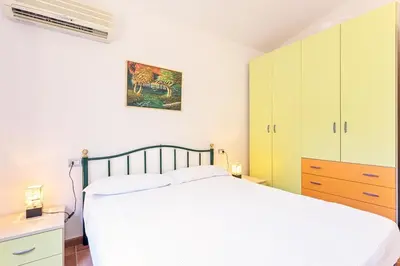 Letto o letti in una camera di Casa Leomilda