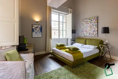 Letto o letti in una camera di Hotiday Cagliari Porto