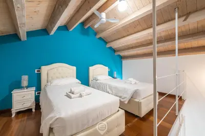 Letto o letti in una camera di Sardinia Holiday Suites