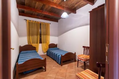 Letto o letti in una camera di Su Castangiu