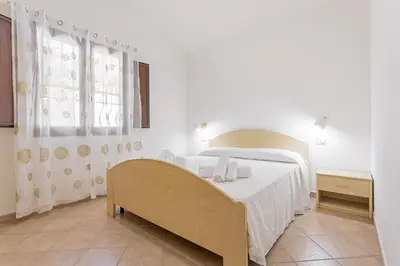 Letto o letti in una camera di Villa Tronciu