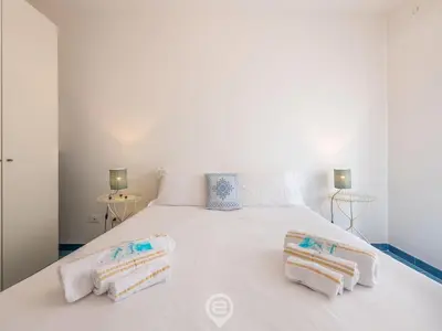 Letto o letti in una camera di Casa Ariel